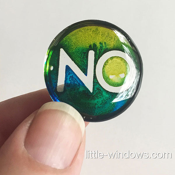 resin idea with alcohol ink and stickers